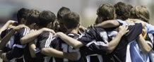Photograph of team players huddle